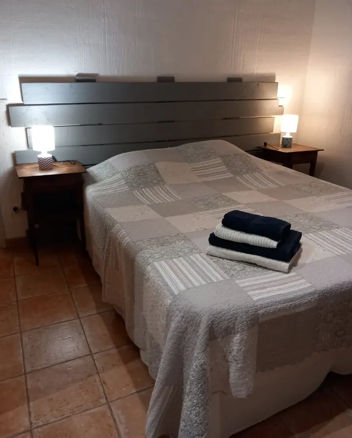 Double bedroom with patchwork bedspread