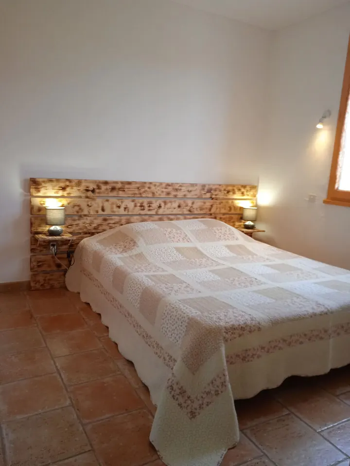 Bedroom with wooden headboard